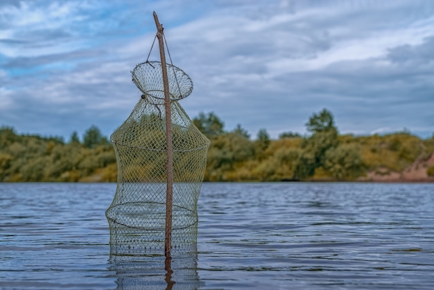 Net for storing fish in a lake