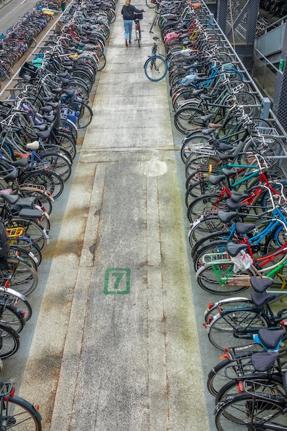 Netherlands A day in Amsterdam Rows of bicycles in a large street parking