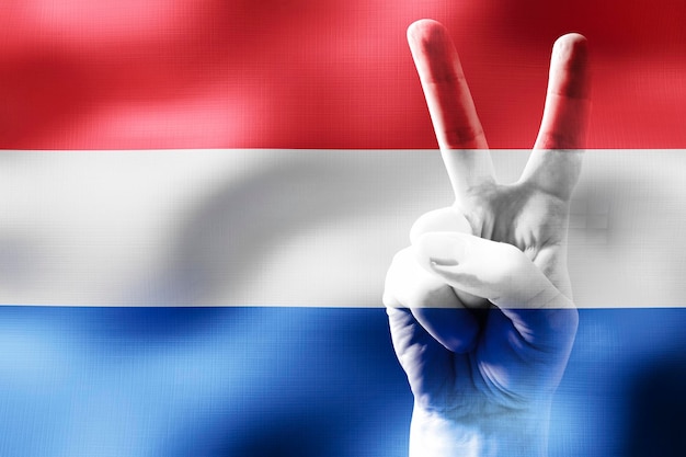 Нидерланды два пальца, показывающие знак мира и национальный флаг