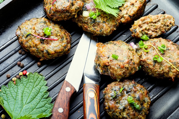 Nettle cutlets in a skillet