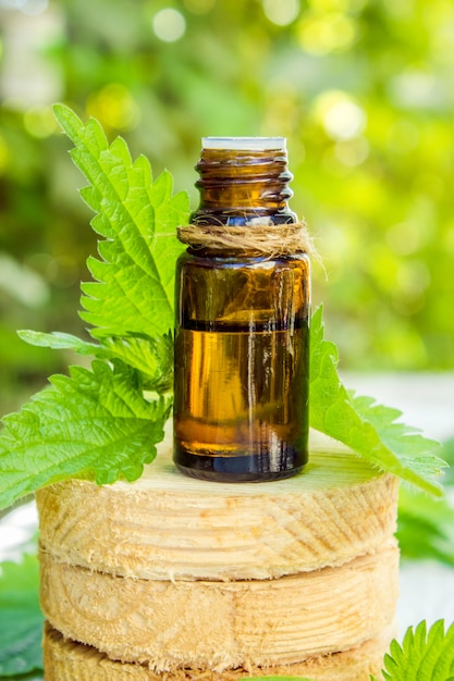 The nettle extract in a small jar. Selective focus.