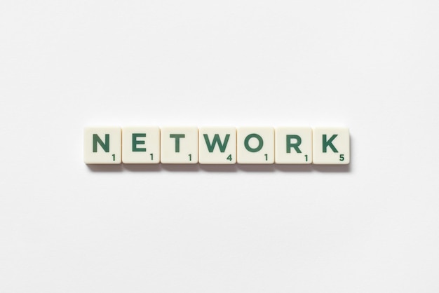 Network formed of scrabble blocks on white background