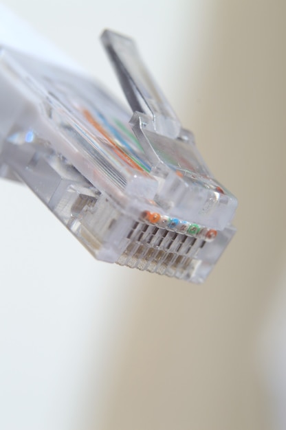 Network LAN cable white with a connector rj 45. close-up.