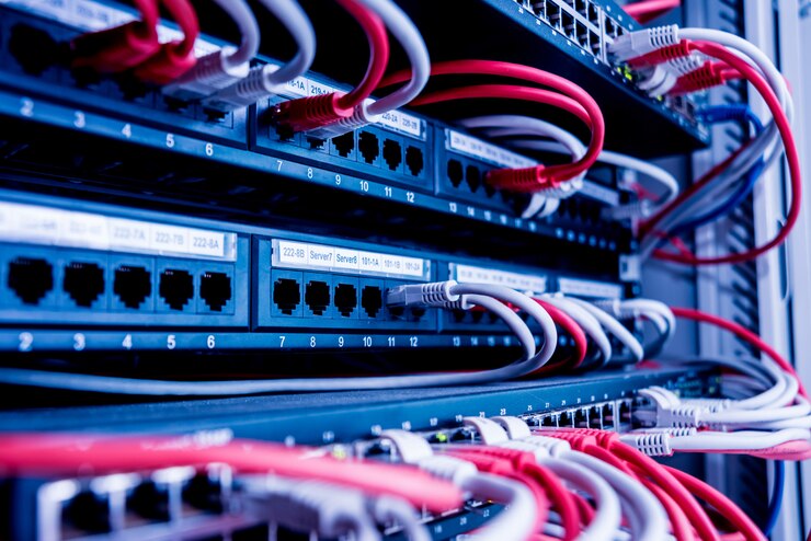 Photo network switch and ethernet cables in red and white colors. data center