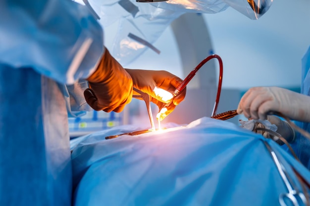 Neurosurgery. Surgeon is operating with special equipment. Doctor`s hands closeup. Modern medical equipment background.