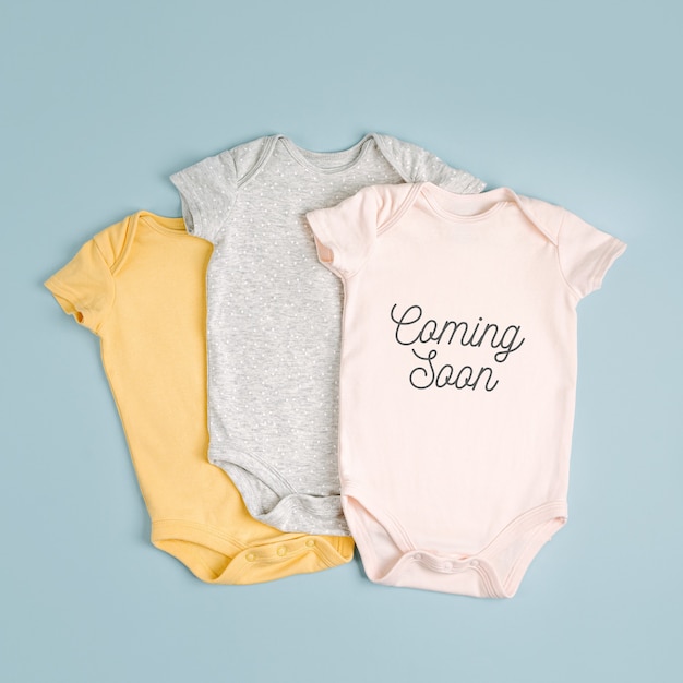 Photo neutral cute baby bodysuits. set of kids clothes. fashion newborn. flat lay, top view