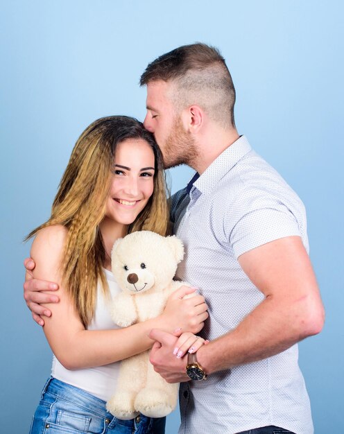 Never boring valentines day present sexy girl and man hold teddy bear family values couple in love family relations and happiness romantic relationship love date man and woman embrace