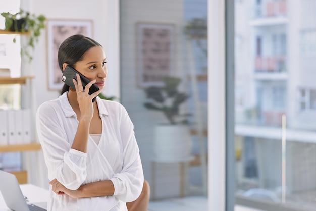 Never called for fame no fighting in your name Shot of a businesswoman on a phone call in a modern office