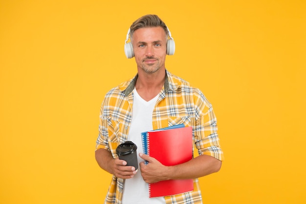 Never too late to study Educational technology Study again Audio book concept Worldwide knowledge access Audio library Another way of study Man handsome college student headphones books