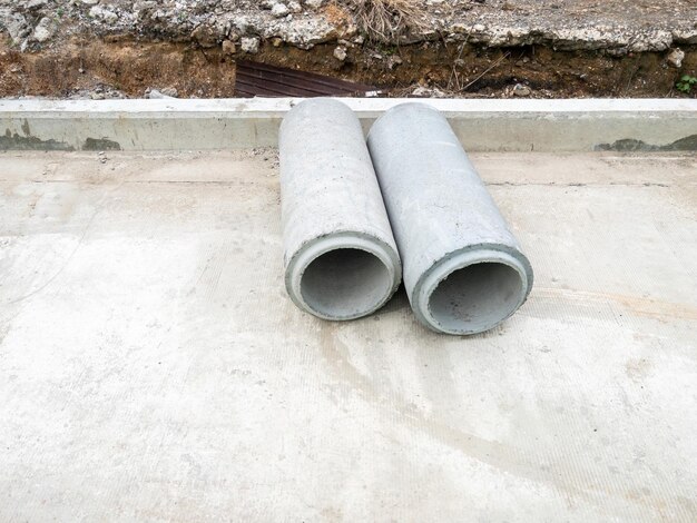 Photo the new ac pipe asbestos cement pipes on the concrete road