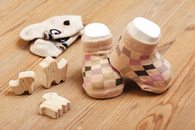 New baby socks on wooden board newborn and baby concept