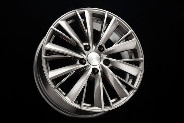 New beautiful silver alloy wheel on a black background