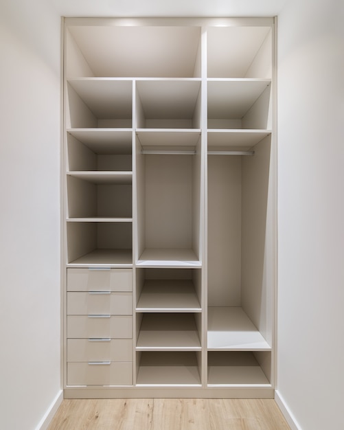 New builtin furniture in a small dressing room modern storage\
room with wardrobe many shelves and drawers