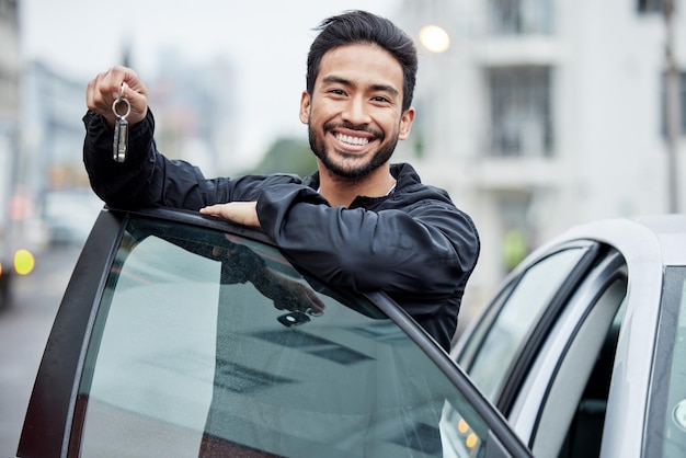 New car city and portrait of man with keys after vehicle purchase to drive transport and travel on street Transportation loan approval and happy person with freedom for trip journey or adventure