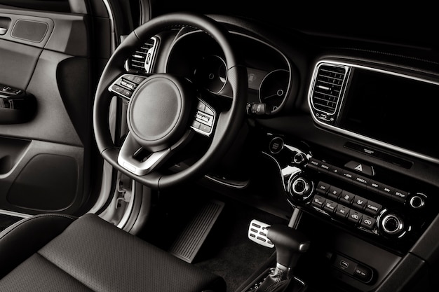 New car steering wheel, luxurious details in black leather