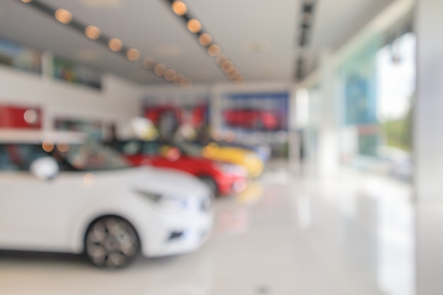 New cars in showroom blurred defocused background