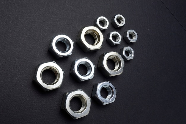 New chrome nuts of different sizes are laid out