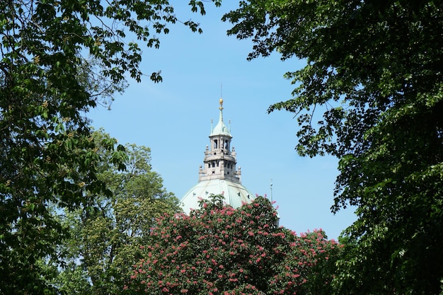 New City Hall in Hannover Germany seen through treetops