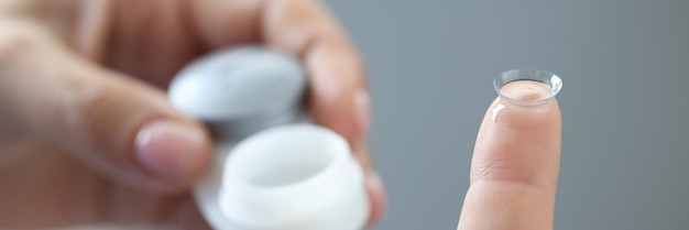 new clear contact lens on finger medicine and vision concept