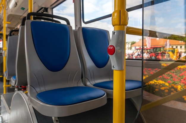 New comfortable seats inside a modern public bus seats on the\
bus for the elderly people with disabilities and passengers with\
children special seats for certain categories of passengers