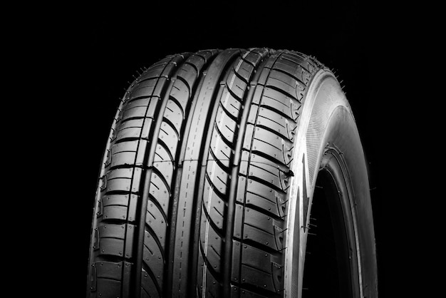 New economical ecofriendly summer tire on a black background copyspace advertising space