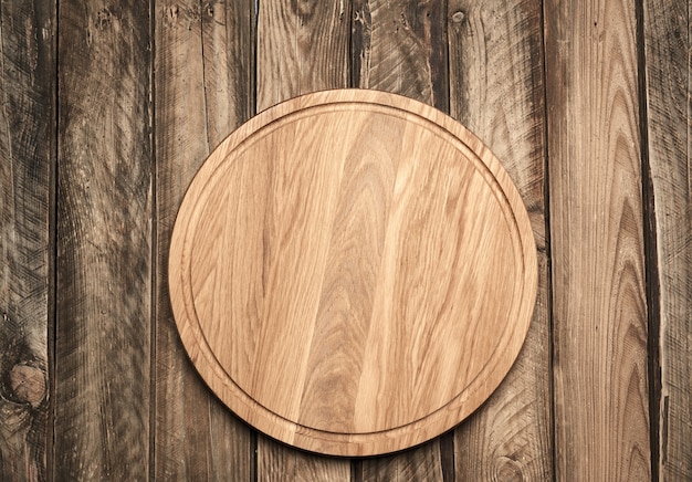 Photo new empty round wooden cutting board