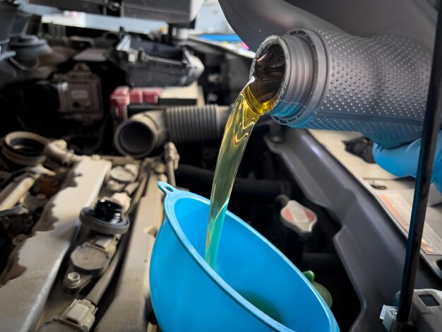 New engine oil pouring to engine