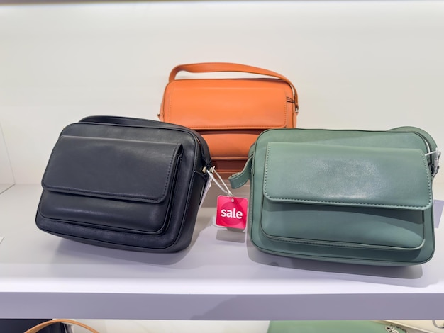 New fashion female handbags display window in dry goods store