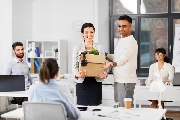 new female employee meeting colleagues at office