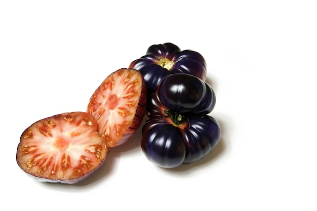 New genetic hybrid tomato variety a blue tomato cut in half isolated on white background