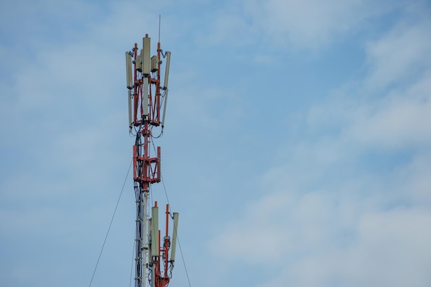 New GSM antennas on a tower against a blue sky for transmitting a 5g signal are dangerous Radiation pollution of the environment through cell towers New technologies in the field of communication