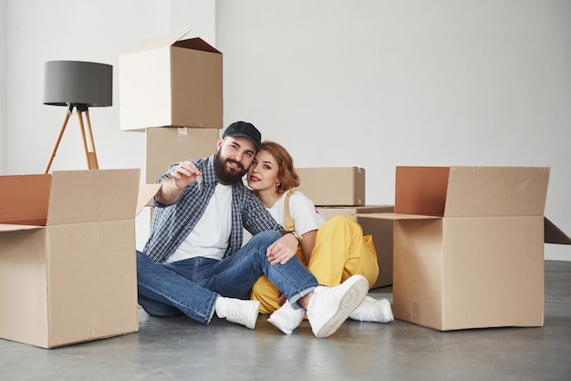 New home, new life. Happy couple together in their new house. Conception of moving