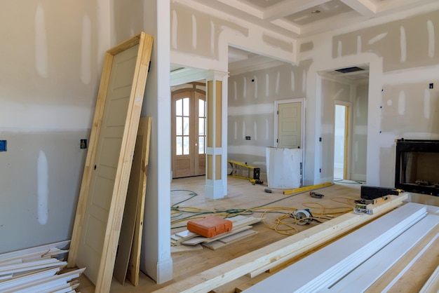 Photo new house under construction with on stacker wooden material door molding trim