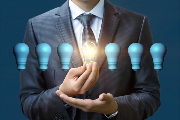 New idea concept a businessman hand holding light bulb