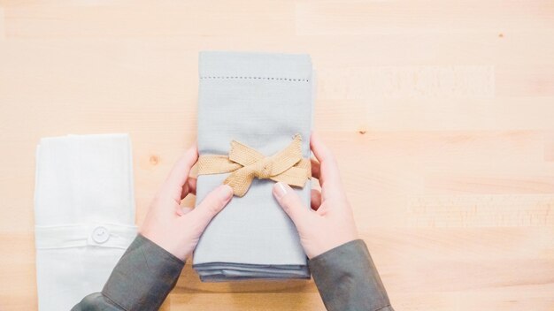 New linen dinner napkin on wood table.