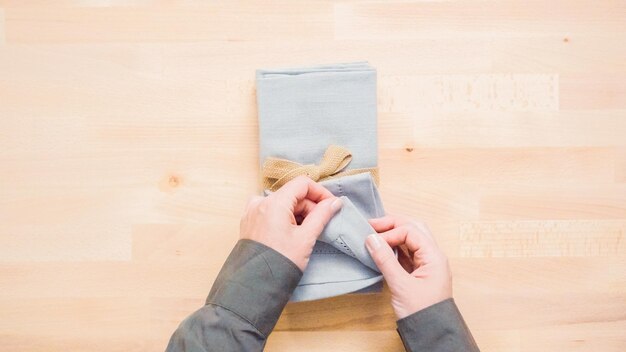 New linen dinner napkin on wood table.