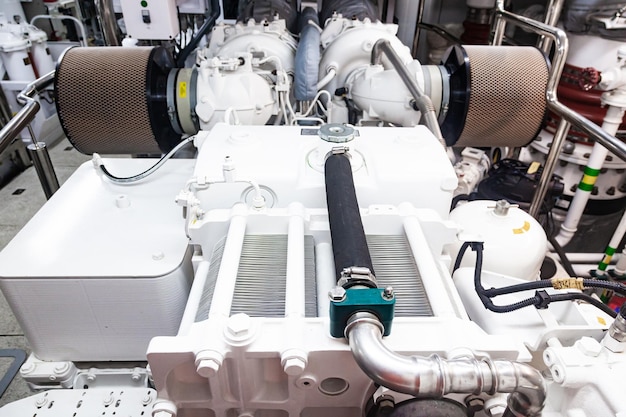 A new marine engine is installed inside a luxury yacht