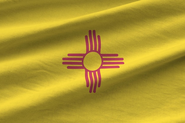 New mexico us state flag with big folds waving close up under the studio light indoors the official