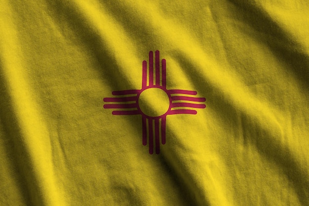 New mexico us state flag with big folds waving close up under the studio light indoors the official