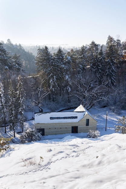 New modern dream house apartments in snowy valley on sunny freezing winter day