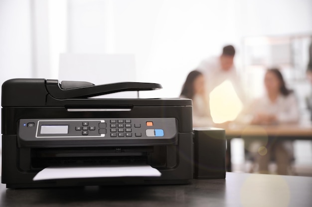 New modern printer on table in office Space for text