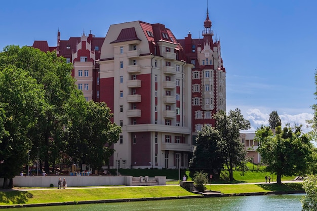 New modern residential apartment buildings district near lake surrounded green trees Housing area