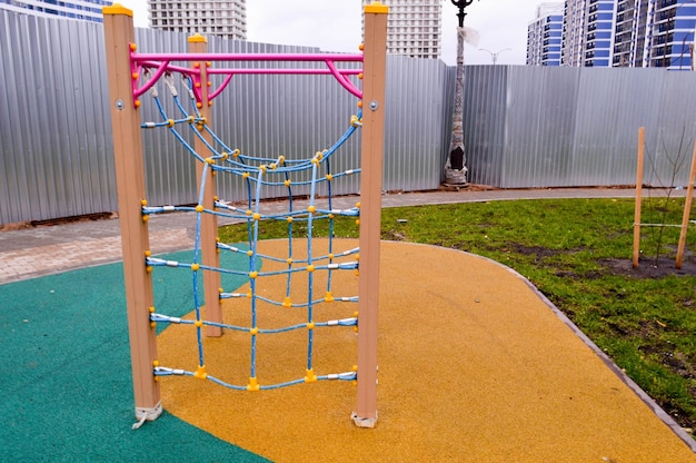 New modern safe outdoor playground in the open air with exercise equipment and toys