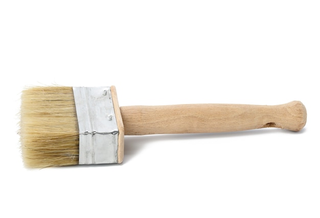 New paint brush with wooden handle isolated on white background, close up