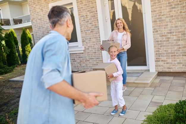 New place . Young family feeling excited while moving to a new house