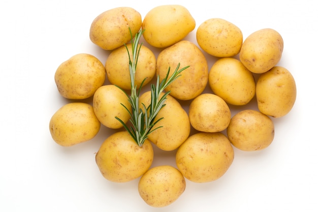 New potato and rosemarin isolated on white background close up