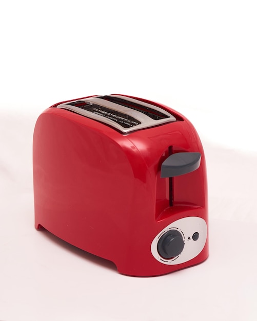 New red toaster on white background