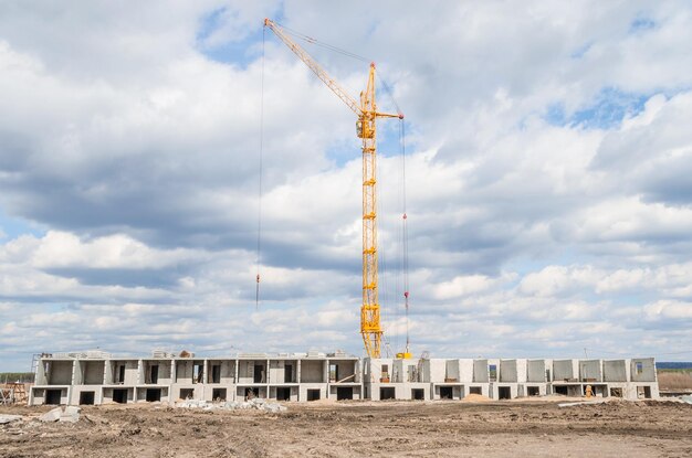 New residential highrise buildings and hoisting tower cranesBuilding of new houses and crane