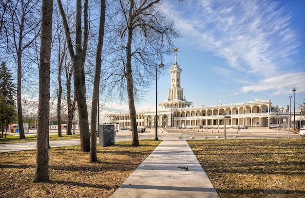 New river station from the park and a squirrel on a path in moscow