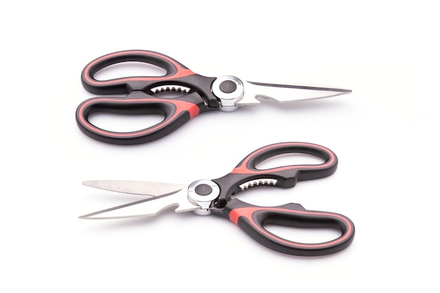 New scissor with red and black color on handle isolated on white